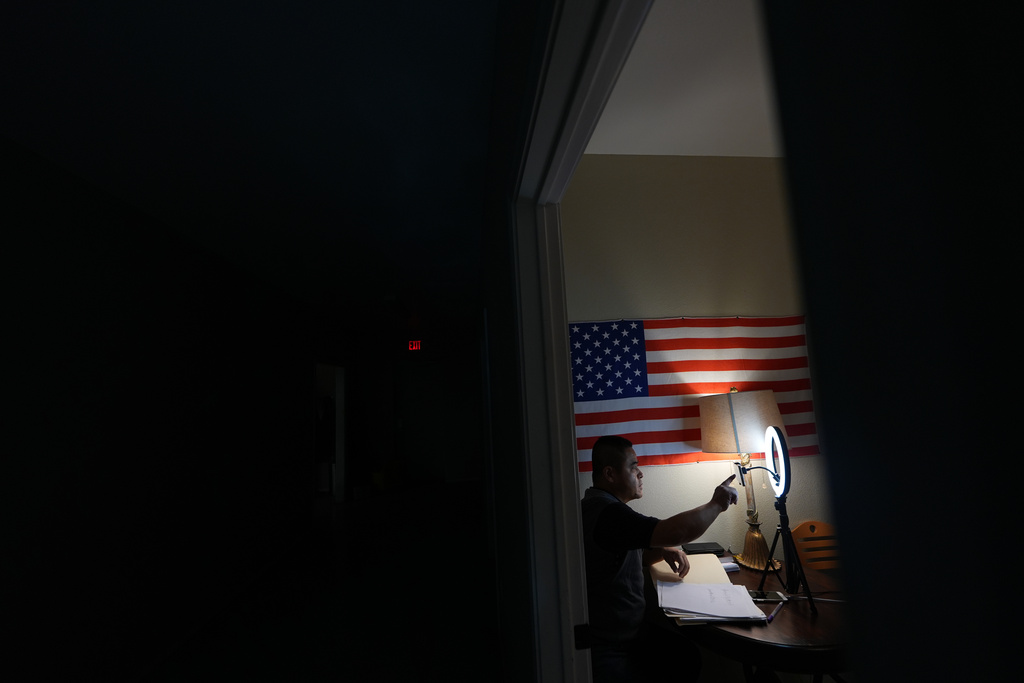 Former Chinese official Li Chuanliang films a YouTube broadcast from the Mayflower Church community in Midland, Texas, Jan. 18, 2025. (AP Photo/Rebecca Blackwell)