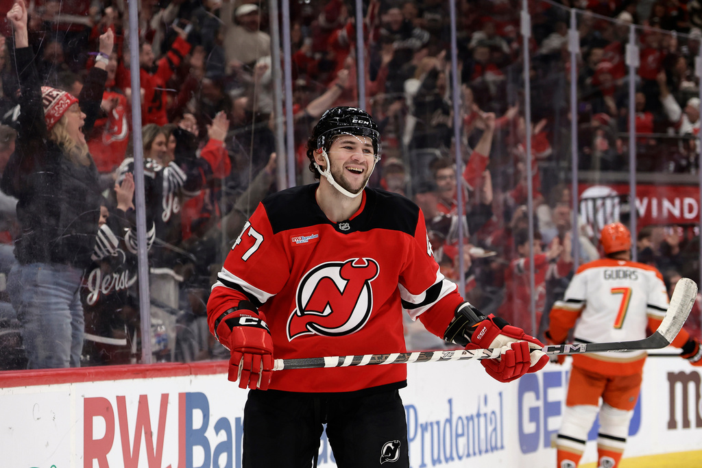 New Jersey Devils left wing Paul Cotter (47) reacts after scoring a goal during the second period of an NHL hockey game against the Anaheim Ducks, Saturday, Dec. 13, 2025, in Newark, N.J. (AP Photo/Adam Hunger)