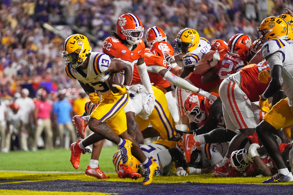 LSU running back Dilin Jones (13) carries for a touchdown against Clemson in the first half of an NCAA college football game, Saturday, Sept. 5, 2026 in Baton Rouge, La. (AP Photo/Gerald Herbert)