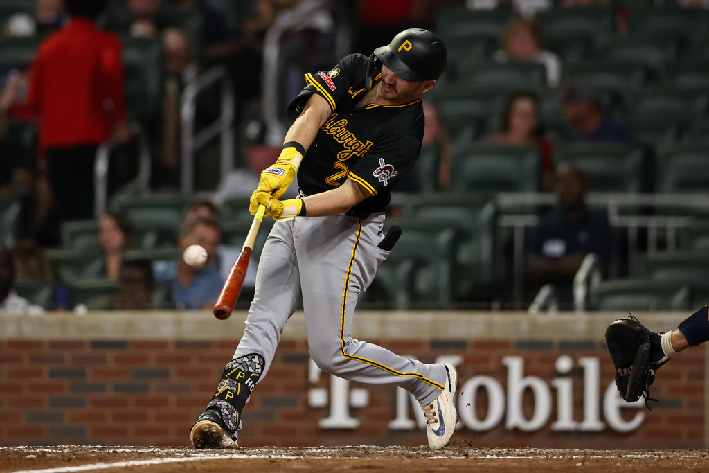 Pittsburgh Pirates' Spencer Horwitz hits a solo home run in the seventh inning of a baseball game against the Atlanta Braves, Friday, Sept. 26, 2025, in Atlanta. (AP Photo/Colin Hubbard)
