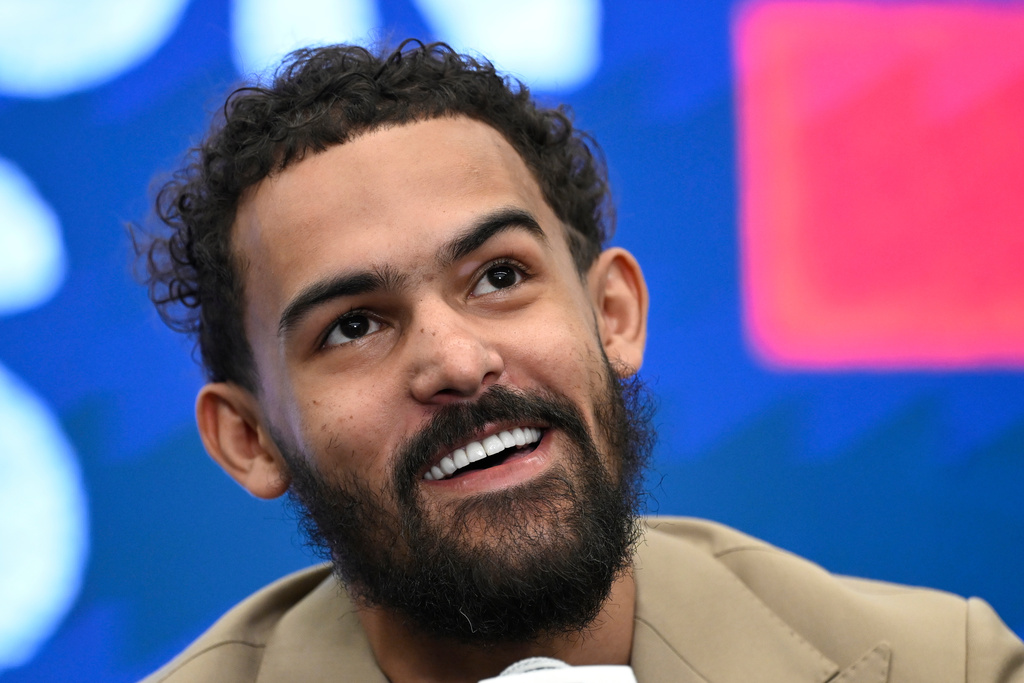 Washington Wizards newly acquired point guard Trae Young answers a question at news conference before an NBA basketball game against the New Orleans Pelicans, Friday, Jan. 9, 2026, in Washington. (AP Photo/John McDonnell)