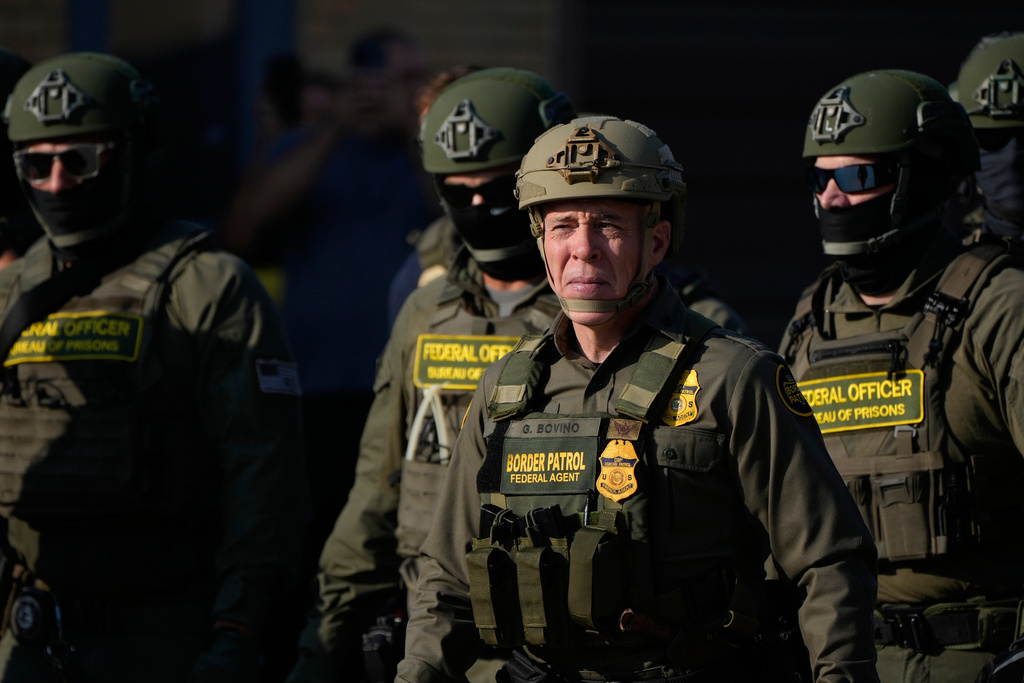 Greg Bovino, the chief patrol agent for the U.S. Border Patrol El Centro sector, center, stands with federal immigration agents near an Immigration and Customs Enforcement facility in Broadview, Ill., Friday, Oct. 3, 2025. (AP Photo/Erin Hooley)