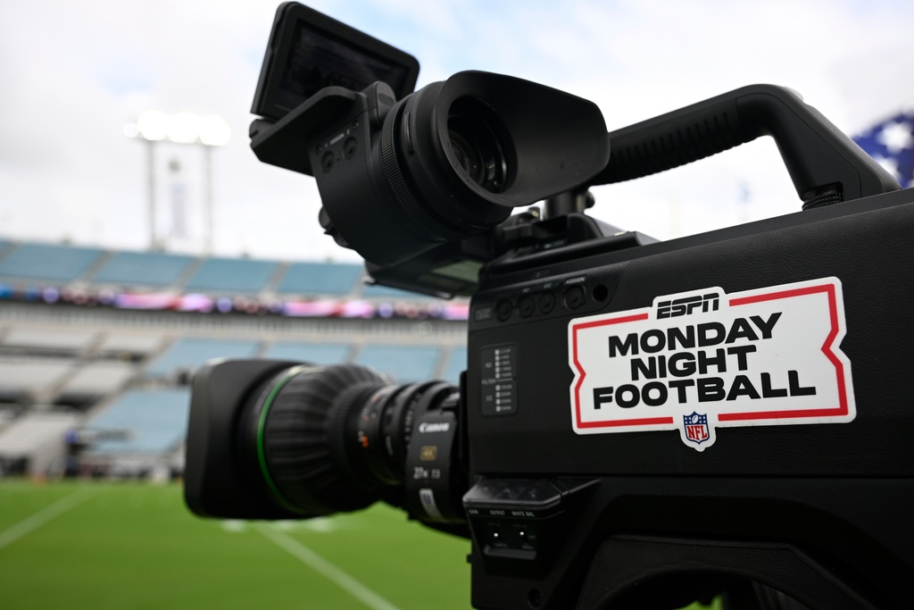 FILE - An ESPN Monday Night Football logo is viewed on a broadcast camera before an NFL football game between the Jacksonville Jaguars and the Kansas City Chiefs, Oct. 6, 2025, in Jacksonville, Fla. (AP Photo/Phelan M. Ebenhack, File)
