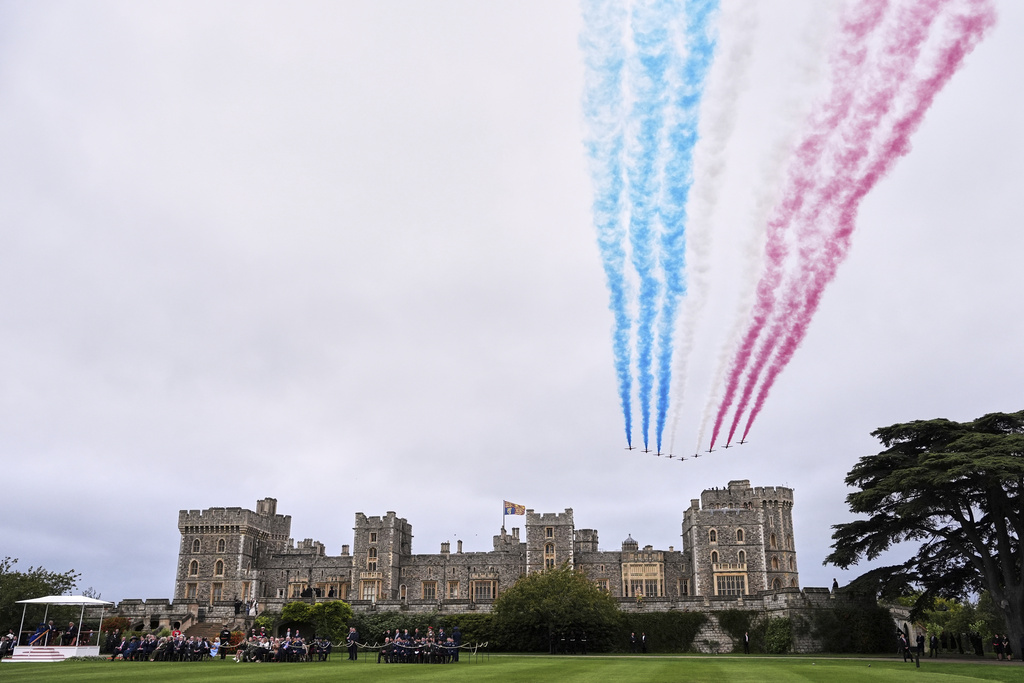 The Red Arrows fly in formation over Windsor Castle during the State visit of President Donald Trump and first lady Melania Trump in Windsor, England, Wednesday, Sept. 17, 2025. (AP Photo/Evan Vucci)