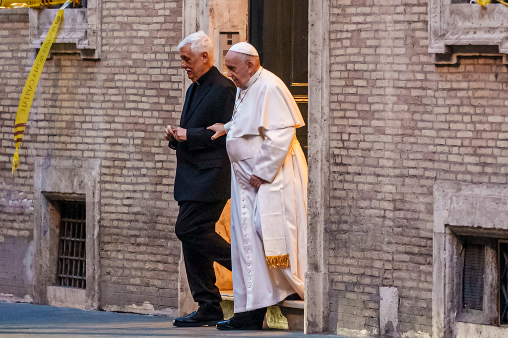FILE - Pope Francis walks with Jesuits' superior general Arturo Sosa Abascal, left, after presiding a mass on March 12, 2022. (AP Photo/Domenico Stinellis, file)