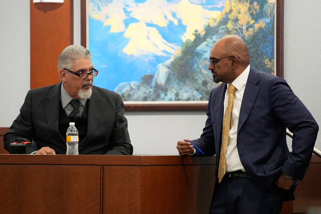 Robert Ladd, a former Compton, Calif., police officer who was part of the department's gang unit, testifies as Chief Deputy District Attorney Binu Palal listens, during the trial for Duane Davis, related to the 1996 killing of rapper Tupac Shakur, at Clark County District Court Regional Justice Center in Las Vegas, Tuesday, Aug. 25, 2026. (AP Photo/John Locher, Pool)