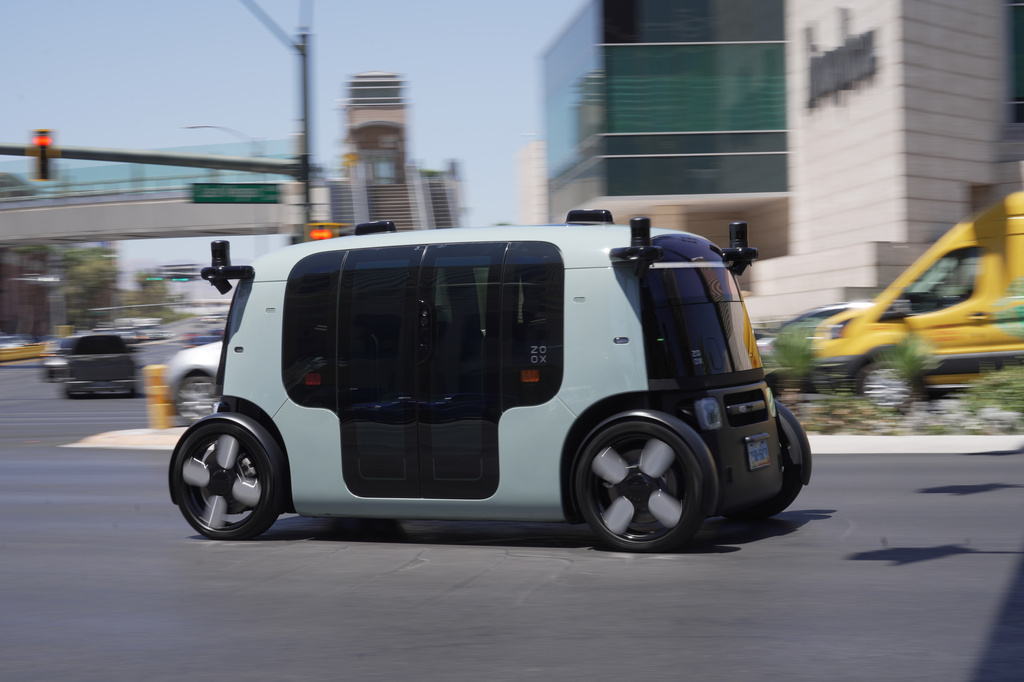 A Zoox taxi with no steering wheel drives down the Las Vegas strip on Thursday, July 30, 2026 (AP photo/Ty ONeil)