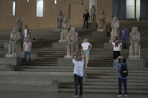 Tourists pose at the Grand staircase at the Grand Egyptian Museum in Giza, Egypt, Friday, May 23, 2025. (AP Photo/Amr Nabil) Tourists pose at the Grand staircase at the Grand Egyptian Museum in Giza, Egypt, Friday, May 23, 2025. (AP Photo/Amr Nabil)