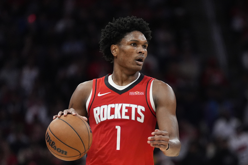 FILE - Houston Rockets guard Amen Thompson controls the ball during the second half of an NBA basketball game against the San Antonio Spurs in Houston, Jan. 20, 2026. (AP Photo/Ashley Landis, File)