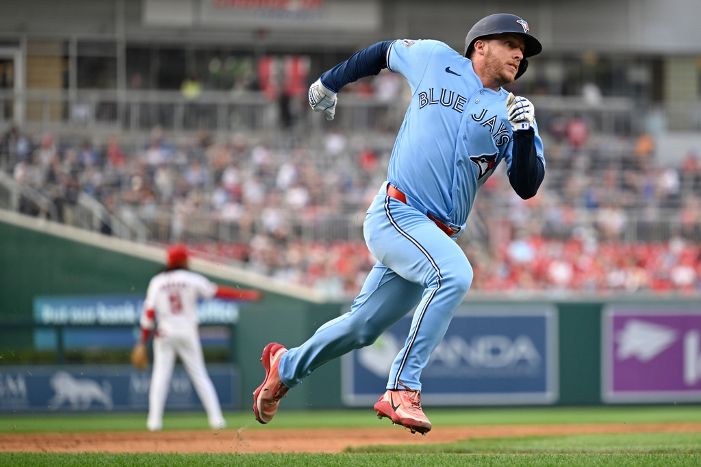 Toronto Blue Jays' Myles Straw heads home to score on an RBI double by Ernie Clement during the third inning of a baseball game against the Washington Nationals, Monday, July 27, 2026, in Washington. (AP Photo/John McDonnell)