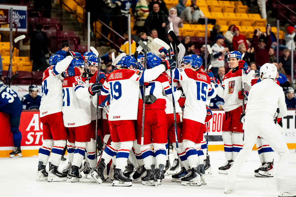 Czechia players celebrate after Adam Jirícek (not shown) scored the winning goal against Finland during overtime IIHF World Junior Hockey Championship game action in Minneapolis, Monday, Dec. 29, 2025. (Christopher Katsarov/The Canadian Press via AP)