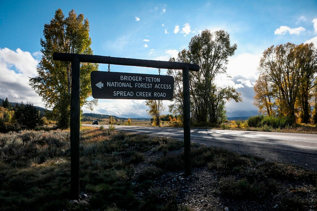 FILE - A sign gives directions to the Bridger-Teton National Forest on Sept. 19, 2021 in Wyoming. (AP Photo/Amber Baesler, File)