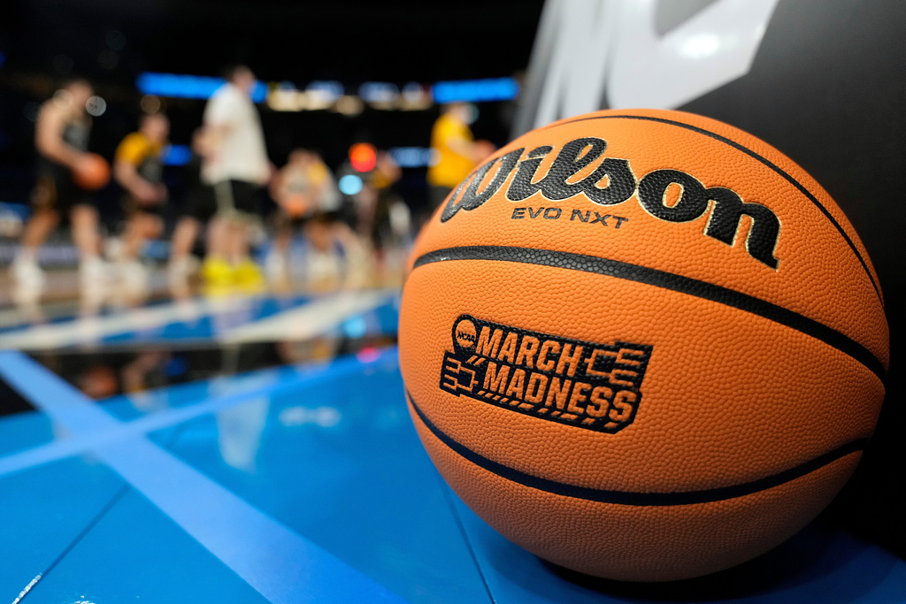 A March Madness basketball rests on the court as Iowa runs drills during practice at the NCAA college basketball tournament Thursday, March 19, 2026, in Tampa, Fla. (AP Photo/Chris O'Meara)