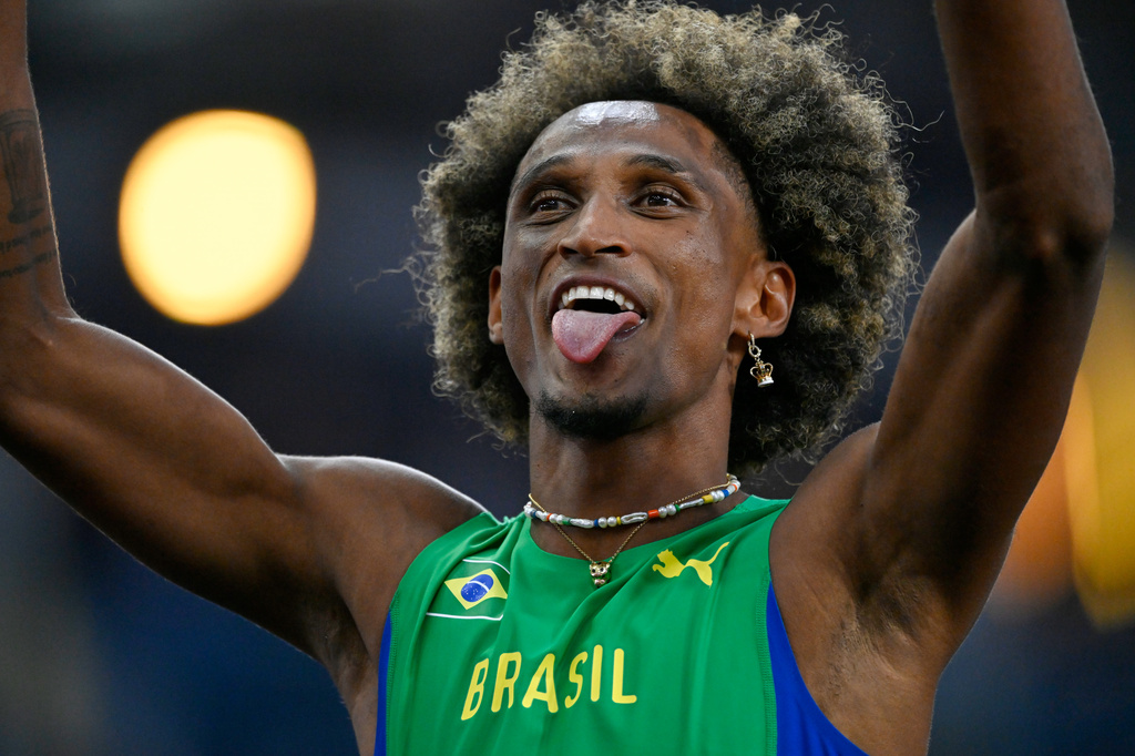 Alison dos Santos, of Brazil, reacts after winning the men's 400 meters hurdles final during the World Athletics Ultimate Championship in Budapest, Hungary, Sunday, Sept. 13, 2026. (AP Photo/Denes Erdos)