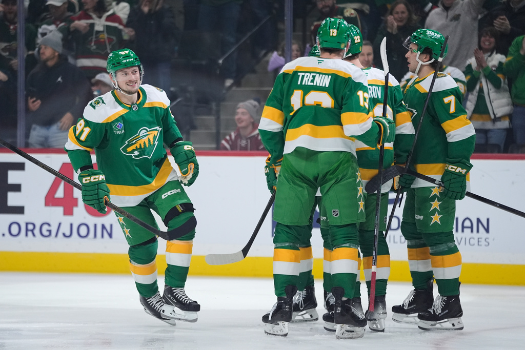 Minnesota Wild right wing Vladimir Tarasenko (91), left, celebrates after scoring a goal during the first period of an NHL hockey game against the Washington Capitals, Tuesday, Dec. 16, 2025, in St. Paul, Minn. (AP Photo/Abbie Parr)