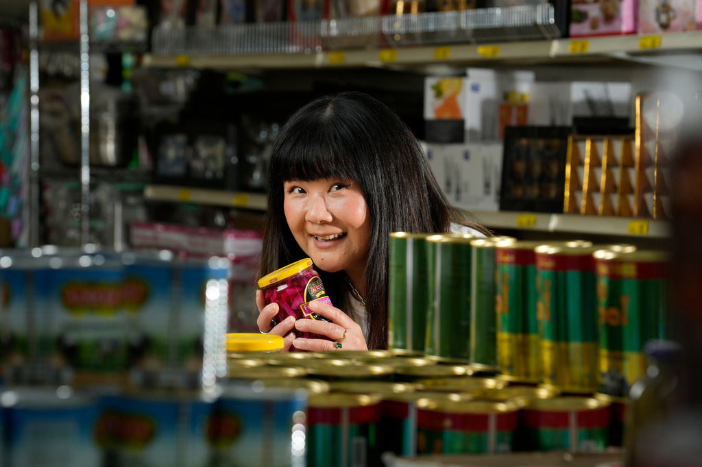 Jenny Yang poses in the Jerusalem Market prior to The Good Egg Immigrant Grocery Store Stand Up Comedy Tour show, July 31, 2026, in Phoenix. (AP Photo/Ross D. Franklin)