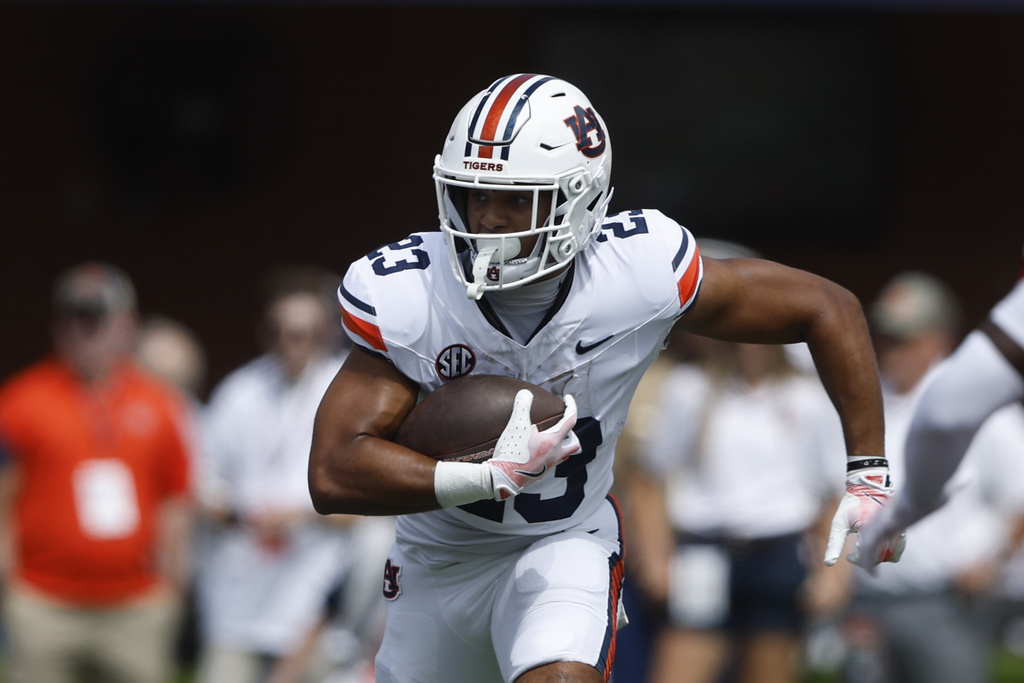 Auburn running back Jeremiah Cobb carries the ball against South Alabama during the first half of an NCAA college football game, Saturday, Sept. 13, 2025, in Auburn, Ala. (AP Photo/Butch Dill)
