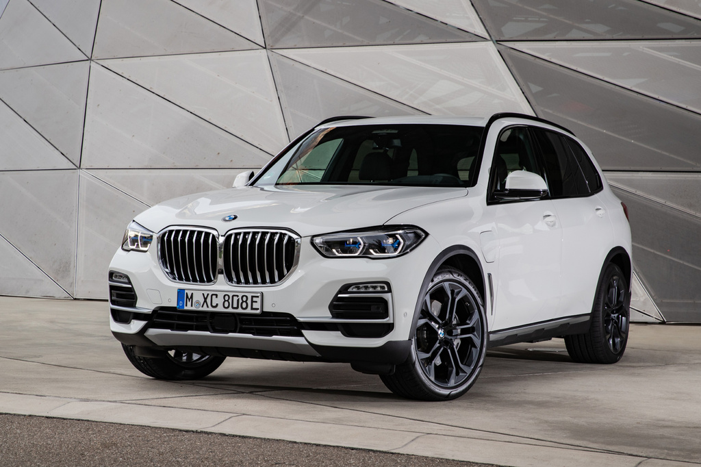 This photo provided by BMW shows a 2021 X5. The plug-in hybrid version of the X5 is ideal for those who want a luxury SUV that can go 30-plus miles on all-electric power. (Courtesy of BMW of North America via AP)