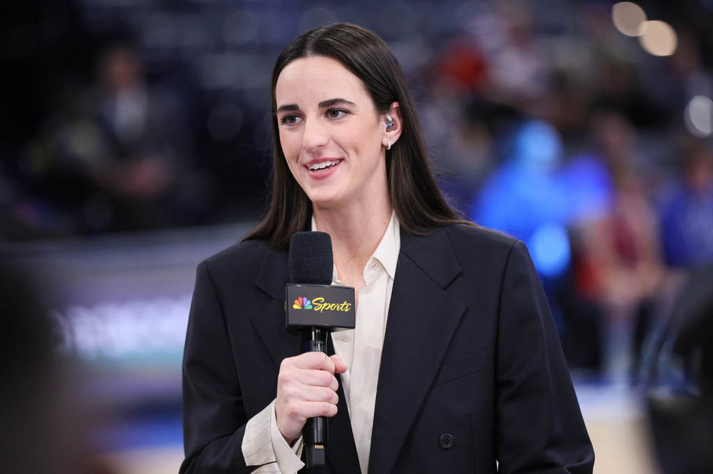 Indiana Fever guard Caitlin Clark participates in an NBC Sports broadcast before an NBA basketball game between the New York Knicks and the Oklahoma City Thunder, Sunday, March 29, 2026, in Oklahoma City. (AP Photo/Nate Billings)
