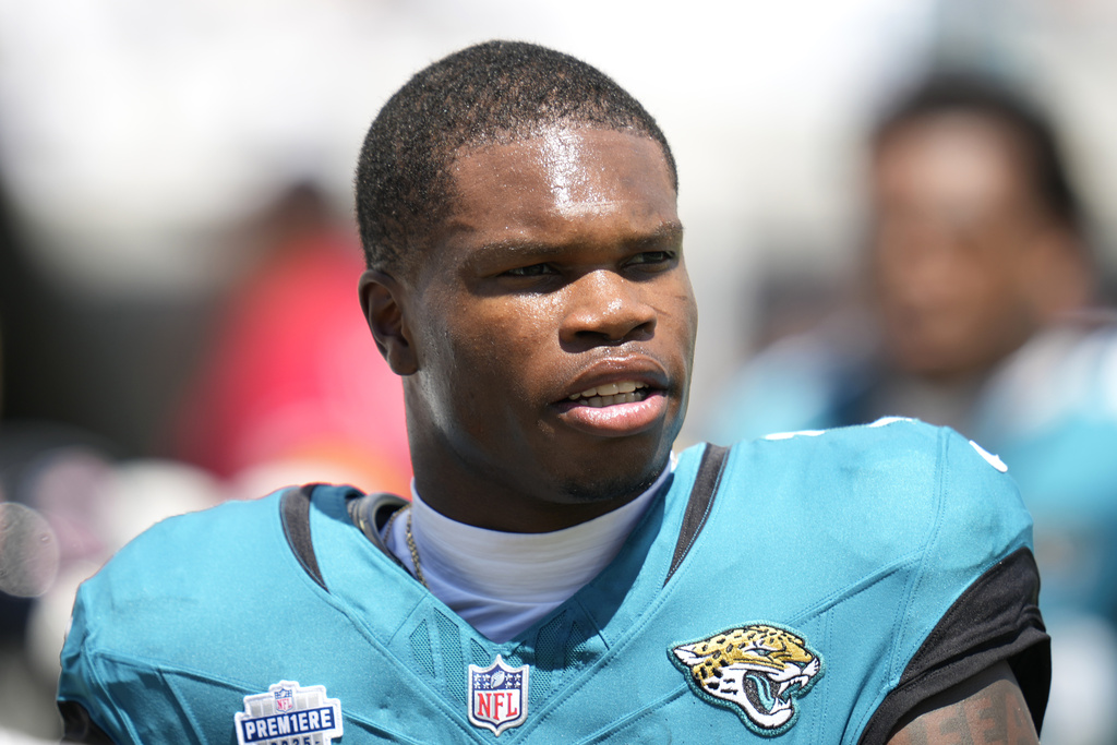 Jacksonville Jaguars wide receiver Travis Hunter (12) looks on before an NFL football game against the Carolina Panthers, Sunday, Sept. 7, 2025, in Jacksonville, Fla. (AP Photo/John Raoux)