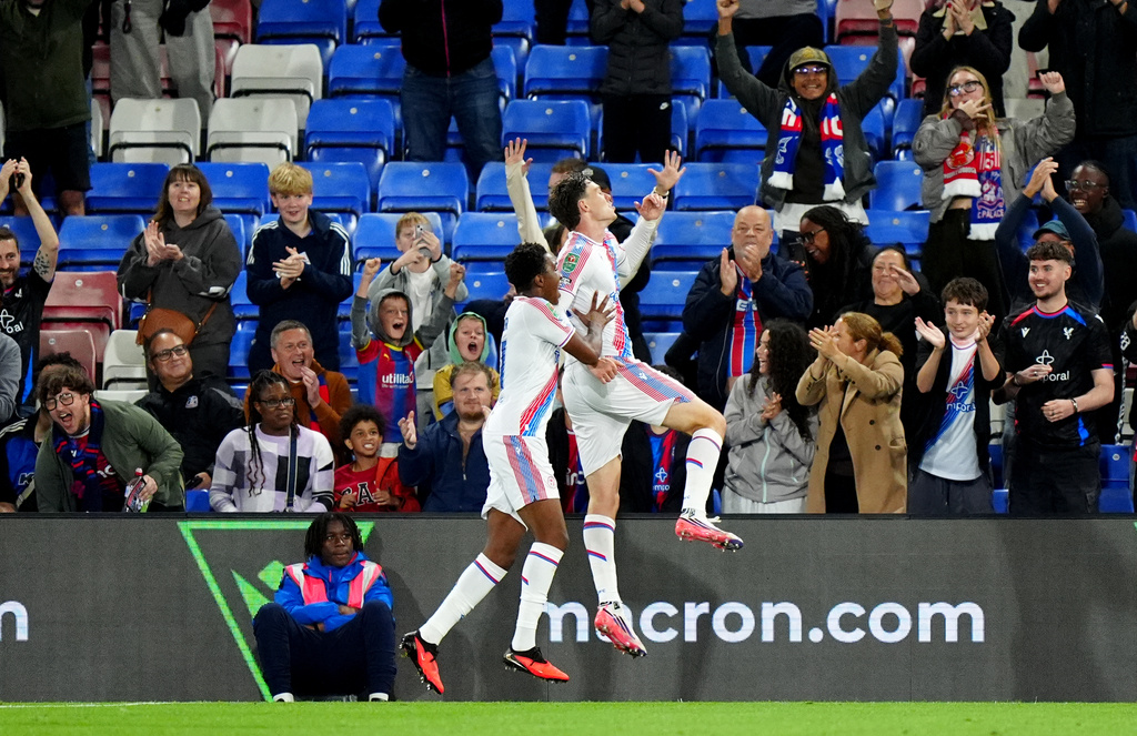 Crystal Palace's Jorgen Strand Larsen, right, celebrates after scoring his sides first goal during the third round soccer match between Crystal Palace and Middlesbrough at Selhurst Park, London, Tuesday, Sept. 8, 2026. (Bradley Collyer/PA via AP)