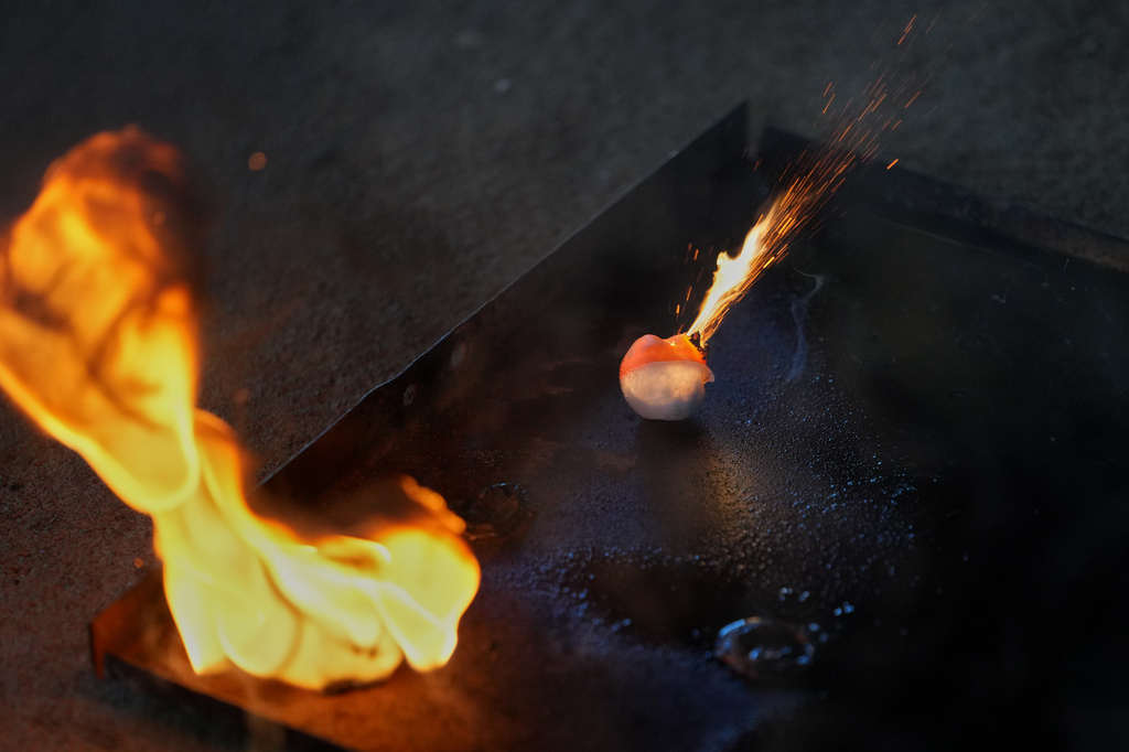 Balls used to ignite fires are displayed during a fire prevention operation by IBAMA officers, Brazil's environmental protection agency, at the Xerente Indigenous territory, near Tocantinia, Tocantins state, Brazil, Tuesday, May 19, 2026. (AP Photo/Andre Penner)