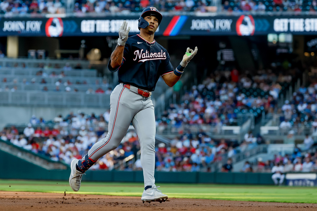 Washington Nationals' Daylen Lile reacts while rounding the bases after hitting a solo home run against the Atlanta Braves during the second inning of a baseball game, Thursday, July 30, 2026, in Atlanta. (AP Photo/Erik S. Lesser)