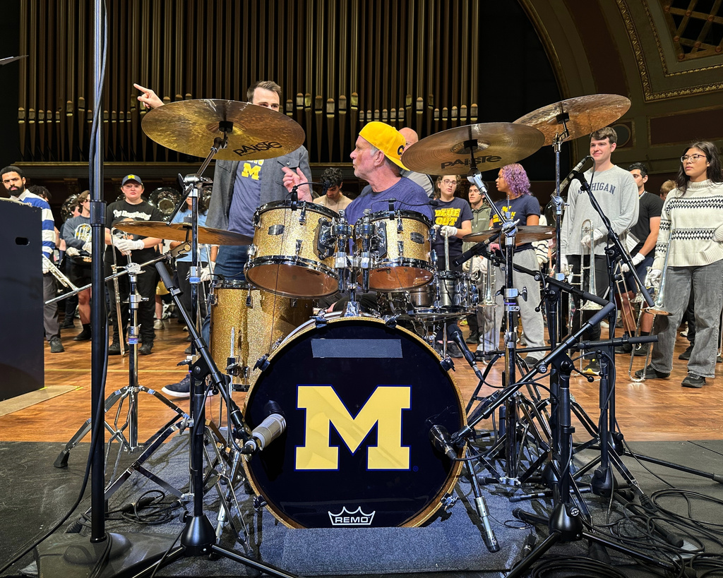 Red Hot Chili Peppers drummer Chad Smith performs with the Michigan Marching Band in Hill Auditorium on the campus of the University of Michigan Sunday, Nov. 2, 2025, in Ann Arbor, Mich. (AP Photo/Mike Householder)