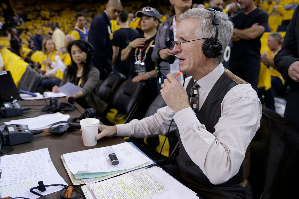 FILE - Mike Breen, NBA play-by-play sports commentator for ABC, prepares for Game 1 of basketball's NBA Finals between the Golden State Warriors and Cleveland Cavaliers on June 4, 2015, in Oakland, Calif. (AP Photo/Ben Margot, File)