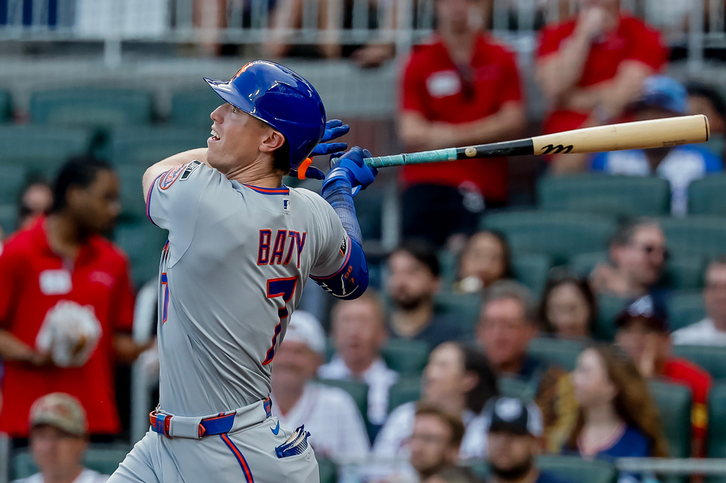 New York Mets' Brett Baty follows through on a grand slam against the Atlanta Braves during the first inning of a baseball game, Monday, Aug. 10, 2026, in Atlanta. (AP Photo/Erik S. Lesser)