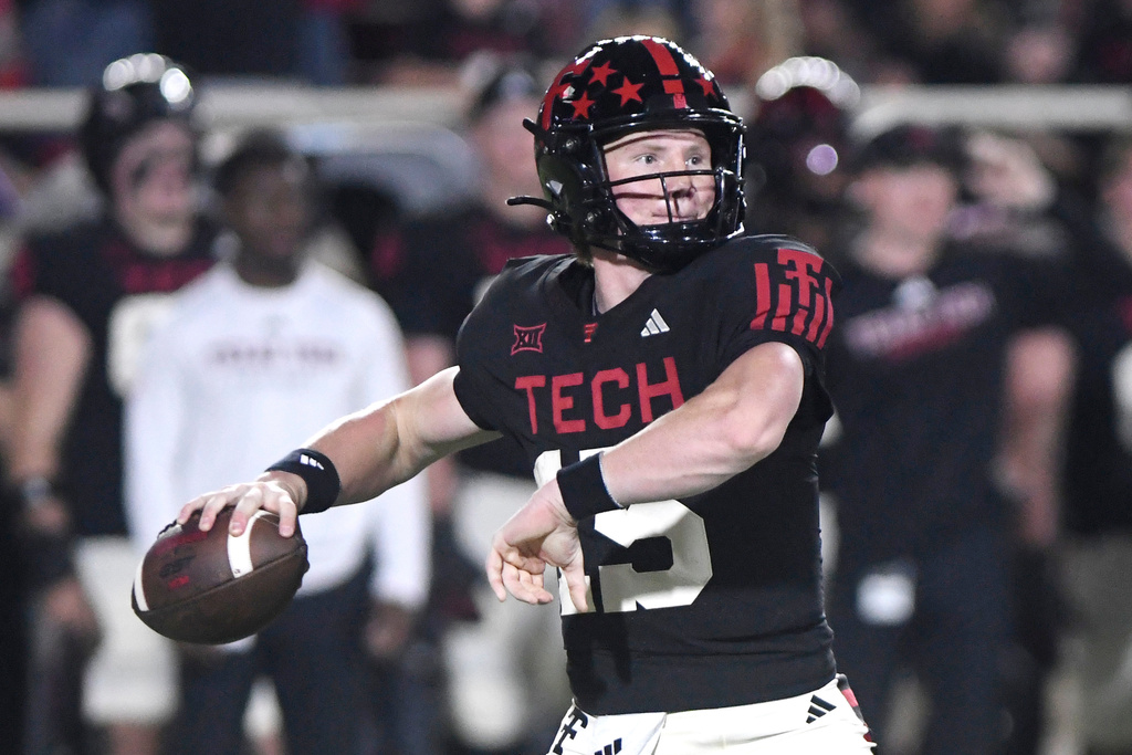 Texas Tech quarterback Will Hammond prepares to throw a pass during the second quarter of an NCAA college football game against Kansas, Saturday, Oct. 11, 2025, in Lubbock, Texas. (AP Photo/Annie Rice)