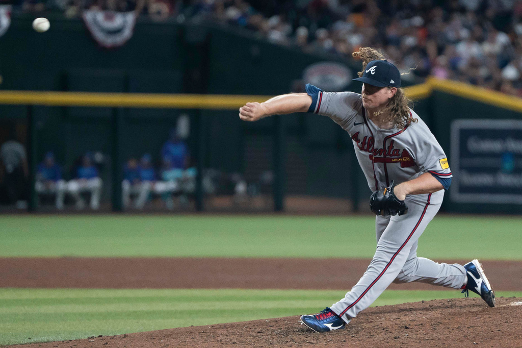 Atlanta Braves pitcher Grant Holmes (66) pitches during a baseball game against the Arizona Diamondbacks, Friday, April 3, 2026, in Phoenix. (AP Photo/Rebecca Noble)