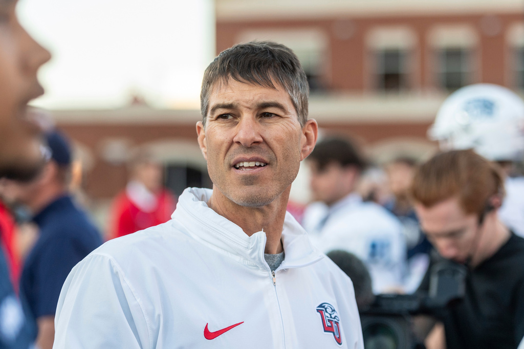 FILE - Liberty's Jamey Chadwell greets players after an NCAA college football game against Old Dominion, Nov. 11, 2023, in Lynchburg, Va. (AP Photo/Robert Simmons, File)