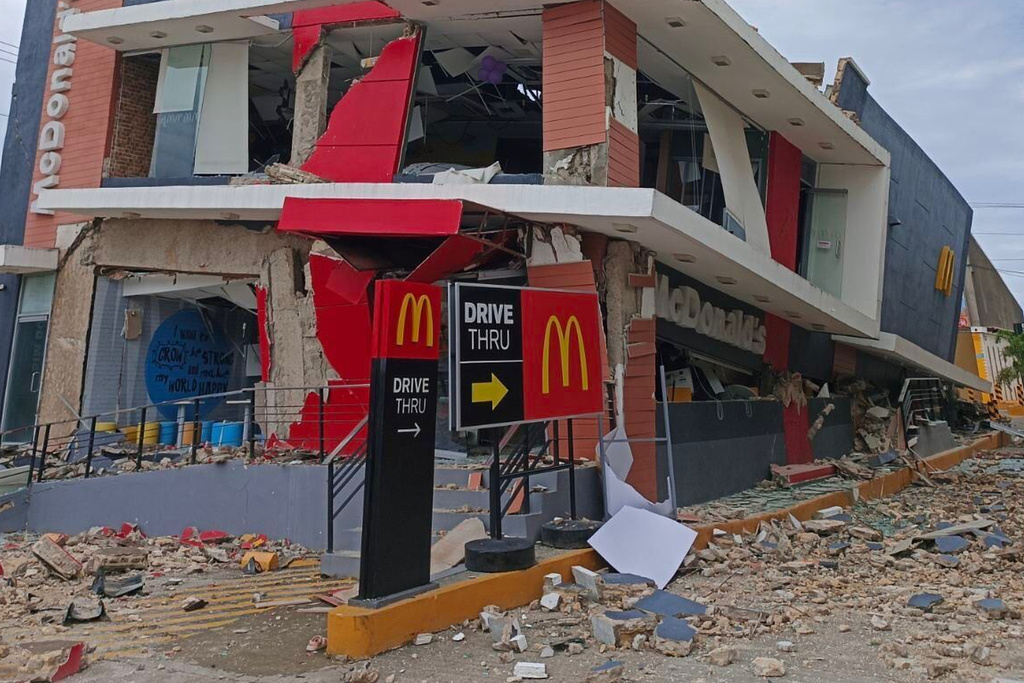 A damaged McDonald's store is seen in Bogo City, Cebu province, Philippines Wednesday, Oct. 1, 2025 after an offshore earthquake on late Tuesday. (AP Photo/Rufino Alub)