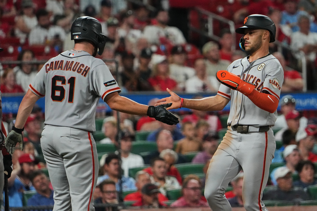 San Francisco Giants' Grant McCray, right, and Drew Cavanaugh (61) celebrate after scoring during the third inning of a baseball game against the St. Louis Cardinals Tuesday, Sept. 15, 2026, in St. Louis. (AP Photo/Jeff Roberson)
