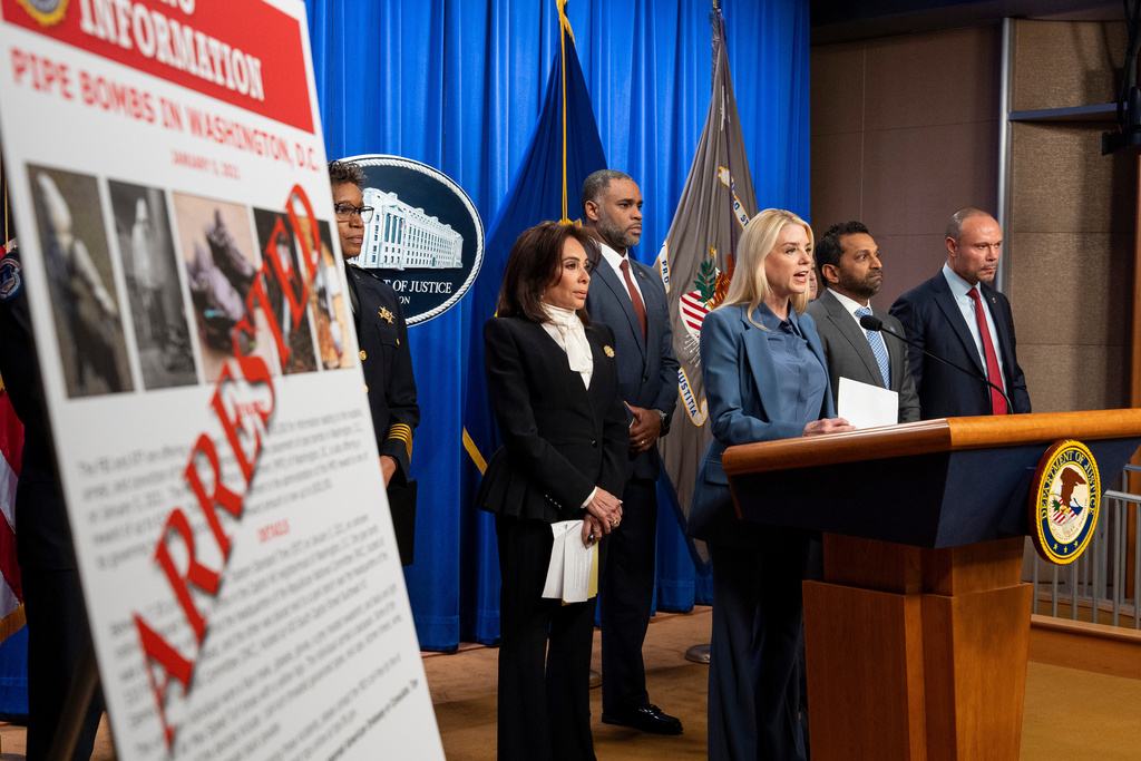 Attorney General Pam Bondi, third from right, Washington Metropolitan Police Chief Pamela Smith, left, U.S. Attorney Jeanine Pirro, ATF Special Agent in Charge of Washington Anthony Spotswood, FBI Director Kash Patel, and FBI deputy director Dan Bongino speak during a news conference at the Department of Justice, Thursday, Dec. 4, 2025, in Washington. (AP Photo/Alex Brandon)