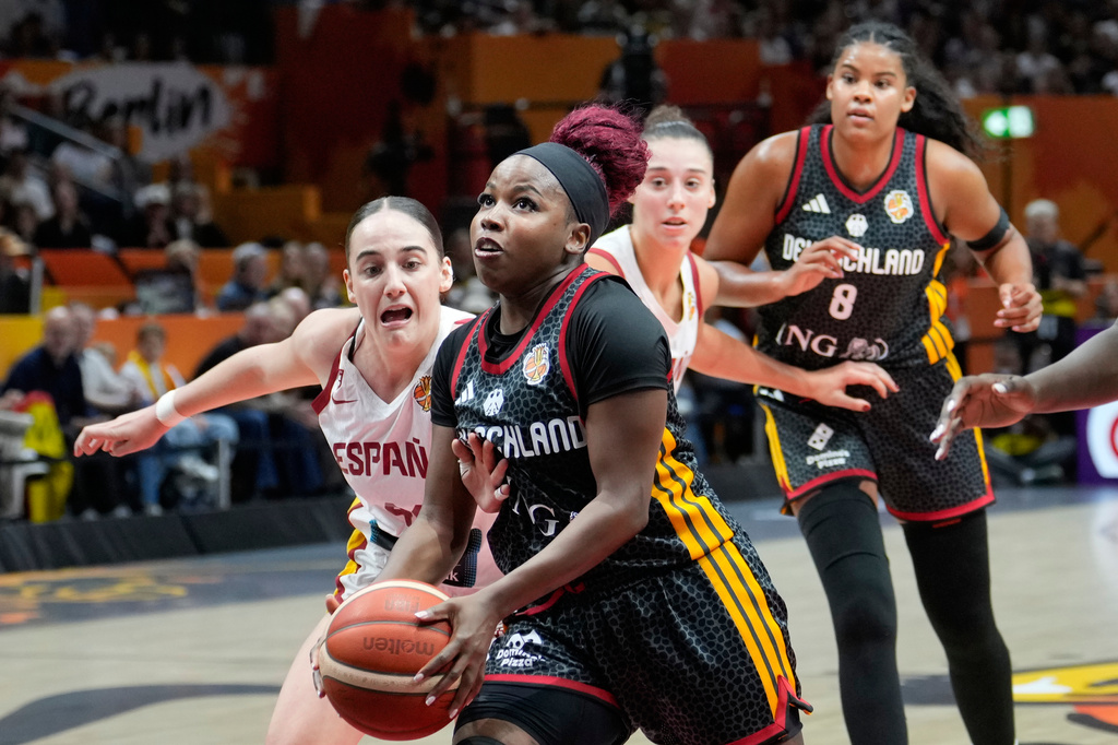 Spain's Iyana Martín fouls Germany's Alexis Peterson during the Women's Basketball World Cup the third-place match between the Germany and Spain in Berlin, Sunday, Sept. 13, 2026. (AP Photo/Ebrahim Noroozi)