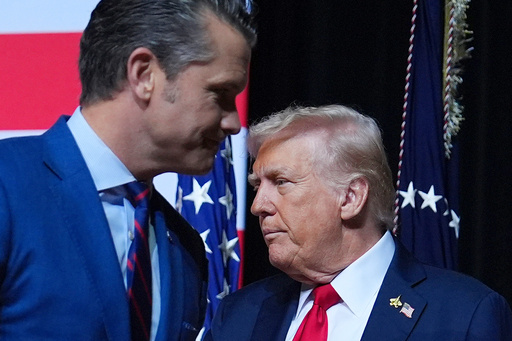 President Donald Trump is greeted by Secretary of Defense Pete Hegseth before speaking to a gathering of top U.S. military commanders at Marine Corps Base Quantico, Tuesday, Sept. 30, 2025, in Quantico, Va. (AP Photo/Evan Vucci) President Donald Trump is greeted by Secretary of Defense Pete Hegseth before speaking to a gathering of top U.S. military commanders at Marine Corps Base Quantico, Tuesday, Sept. 30, 2025, in Quantico, Va. (AP Photo/Evan Vucci)