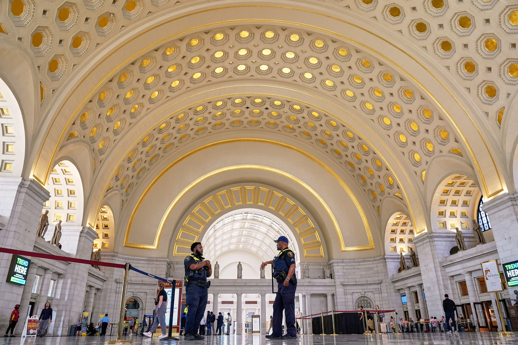 Amtrak Police officers patrol Union Station, Tuesday, Aug. 26, 2025, in Washington. (AP Photo/Mariam Zuhaib)