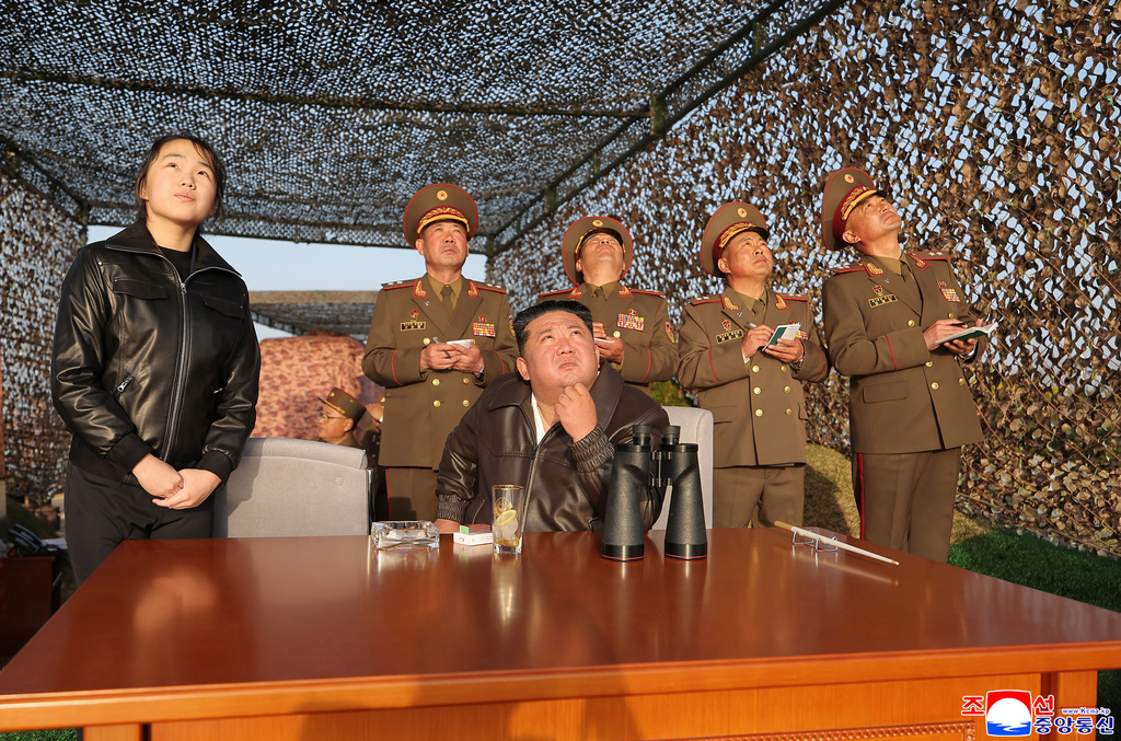 In this photo provided by the North Korean government, its leader Kim Jong Un, sitting, with his daughter observes what it says a test launch of an upgraded surface-to-surface ballistic missile at an undisclosed place in North Korea Sunday, April 19, 2026. Independent journalists were not given access to cover the event depicted in this image distributed by the North Korean government. The content of this image is as provided and cannot be independently verified. Korean language watermark on image as provided by source reads: "KCNA" which is the abbreviation for Korean Central News Agency. (Korean Central News Agency/Korea News Service via AP)