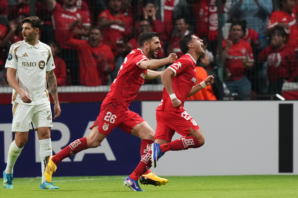 Everardo Lopez of Mexico's Toluca, right, celebrates scoring his side's 2nd goal against of the United States' Los Angeles FC during a CONCACAF Champions Cup second leg semifinal soccer match in Toluca, Mexico, Wednesday, May 6, 2026. (AP Photo/Fernando Llano)