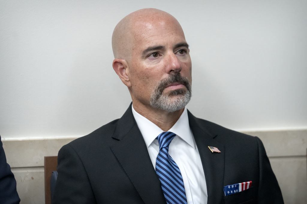 Drug Enforcement Agency Administrator Terrance Cole listens as President Donald Trump speaks with reporters in the James Brady Press Briefing Room at the White House, Monday, Aug. 11, 2025, in Washington. (AP Photo/Mark Schiefelbein)
