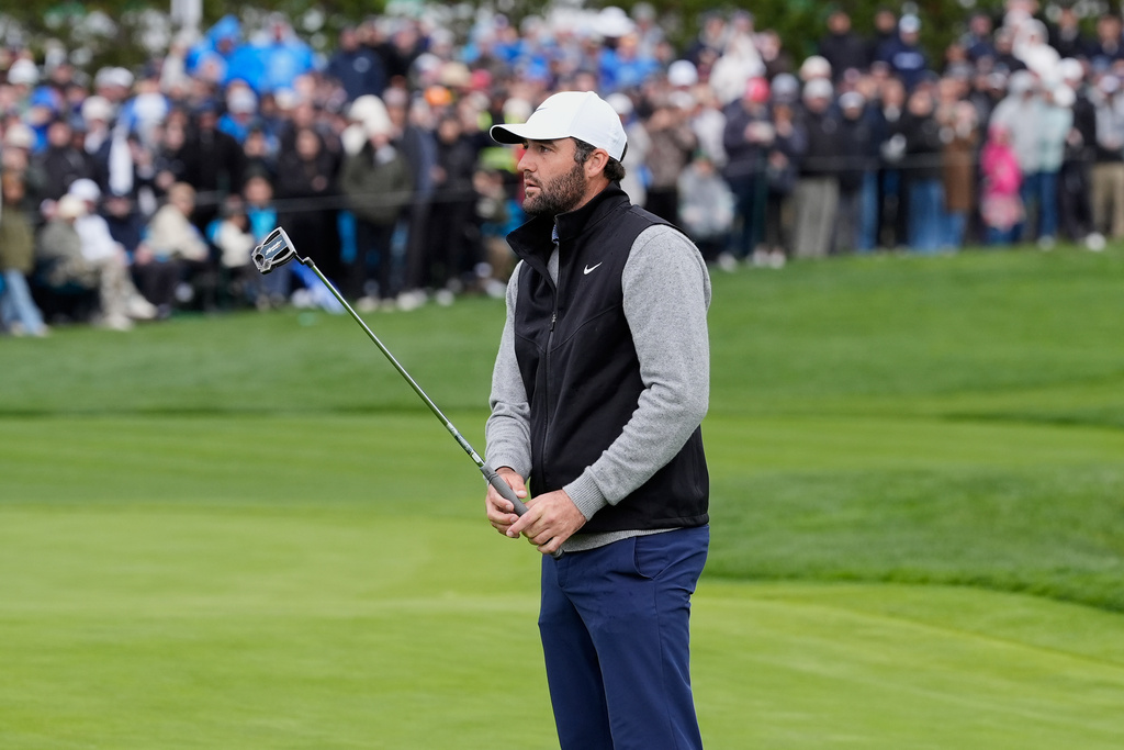 Scottie Scheffler reacts after putting on the 17th hole at Pebble Beach Golf Links during the final round of the AT&T Pebble Beach Pro-Am golf tournament in Pebble Beach, Calif., Sunday, Feb. 15, 2026. (AP Photo/Godofredo A. Vásquez)