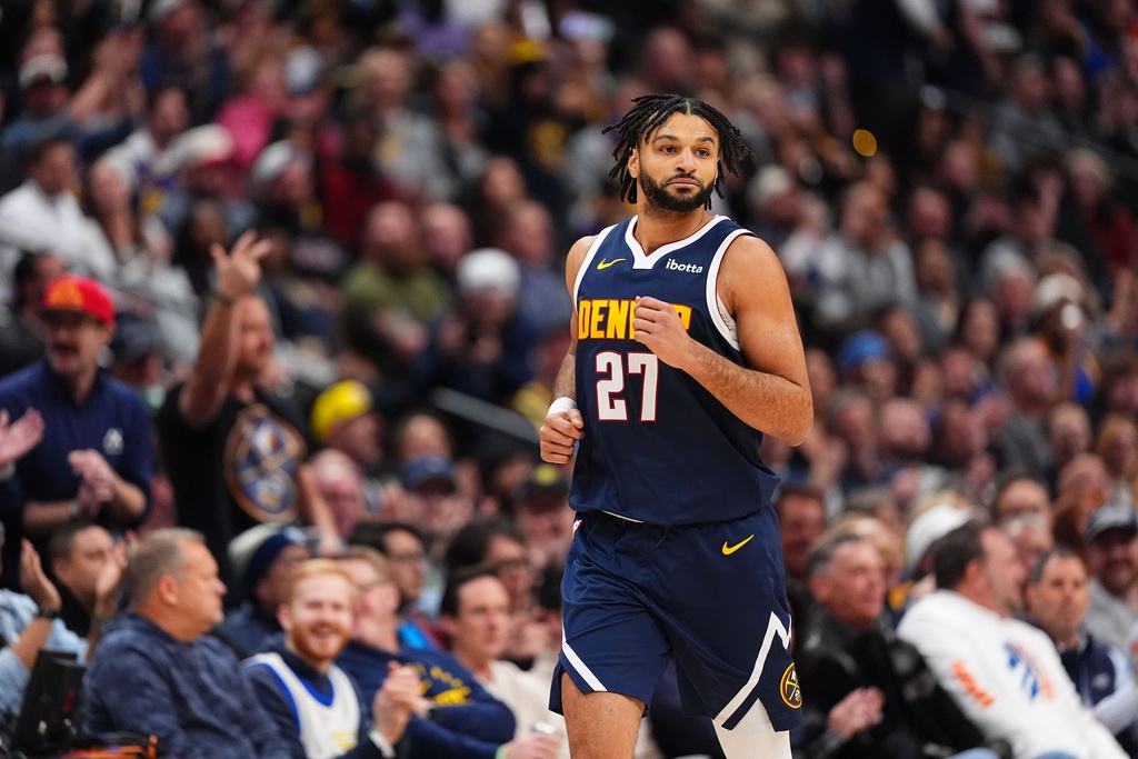 Denver Nuggets guard Jamal Murray celebrates a three point basket against the Los Angeles Lakers during the first half of an NBA basketball game Tuesday, Jan. 20, 2026, in Denver. (AP Photo/Jack Dempsey)