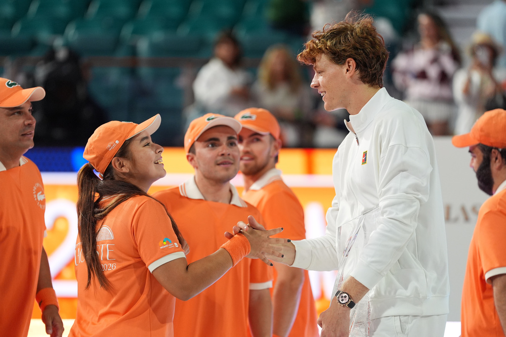 Jannik Sinner of Italy, right, greets tournament volunteers after defeating Jiri Lehecka of the Czech Republic in the men's singles final at the Miami Open tennis tournament, Sunday, March 29, 2026, in Miami Gardens, Fla. (AP Photo/Rebecca Blackwell)