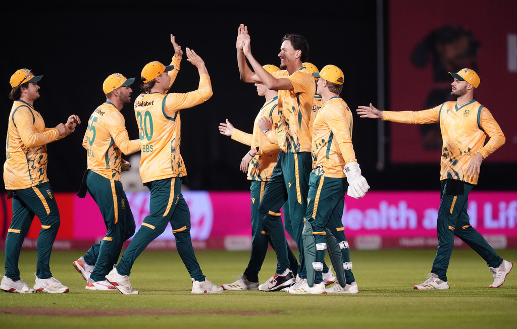 South Africa's Marco Jansen, center, celebrates taking the wicket of England's Jacob Bethell during the first International T20 cricket match at Sophia Gardens in Cardiff, Wales, Wednesday, Sept. 10, 2025. (Nick Potts/PA via AP)