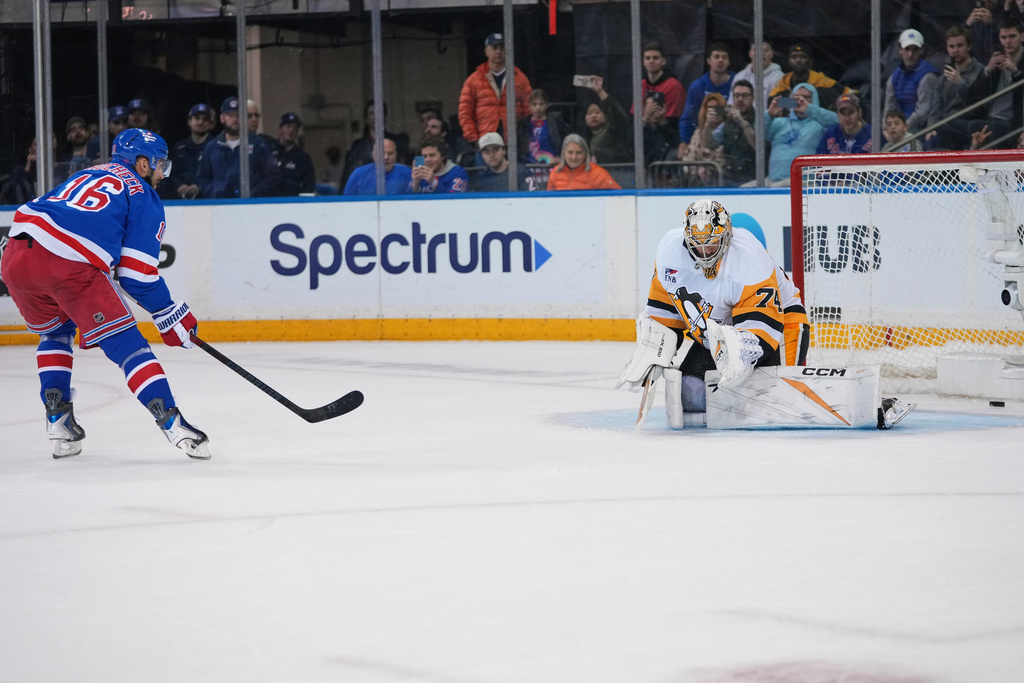 New York Rangers center Vincent Trocheck (16) shoots the puck past Pittsburgh Penguins goaltender Stuart Skinner (74) during a shootout in an NHL hockey game Saturday, Feb. 28, 2026, in New York. (AP Photo/Frank Franklin II)
