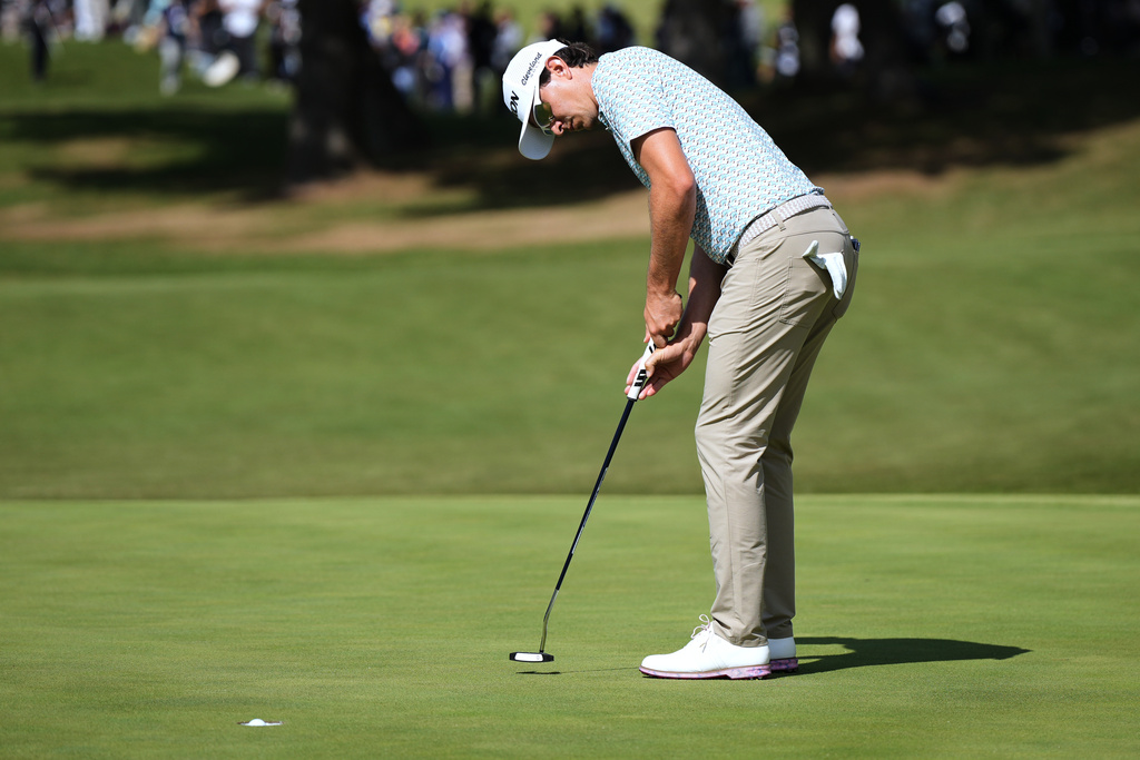 Nico Echavarria of Colombia makes a putter shot on the 15th green during the second round of the Baycurrent Classic golf tournament at the Yokohama Country Club in Yokohama, near Tokyo, Friday, Oct. 10, 2025. (AP Photo/Hiro Komae)