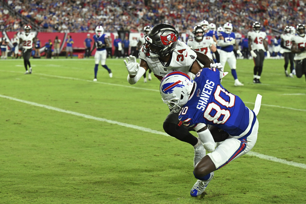 Buffalo Bills wide receiver Tyrell Shavers scores past Tampa Bay Buccaneers cornerback Bryce Hall during the first half of an NFL preseason football game, Saturday, Aug. 23, 2025, in Tampa, Fla. (AP Photo/Jason Behnken)