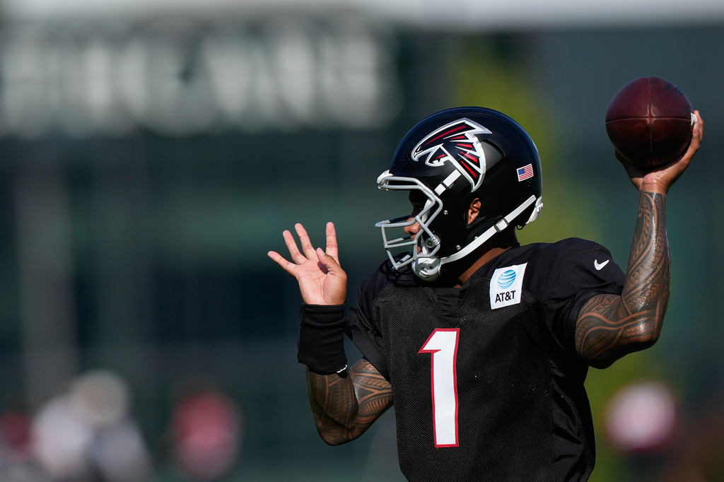 Atlanta Falcons quarterback Tua Tagovailoa (1) runs drills during an NFL football training camp practice on Monday, Aug. 17, 2026, in Flowery Branch, Ga. (AP Photo/Brynn Anderson)